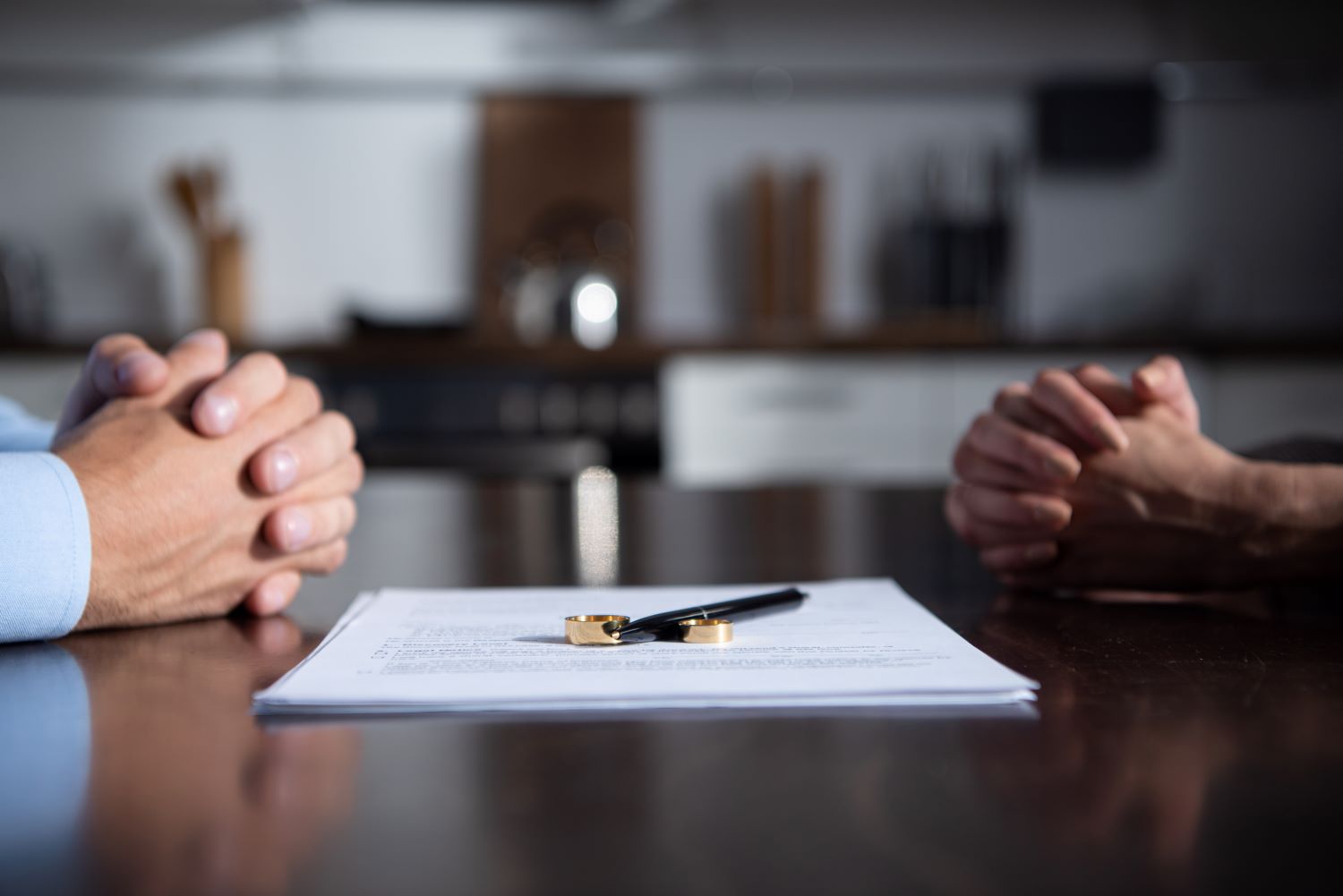 partial view of couple sitting at table